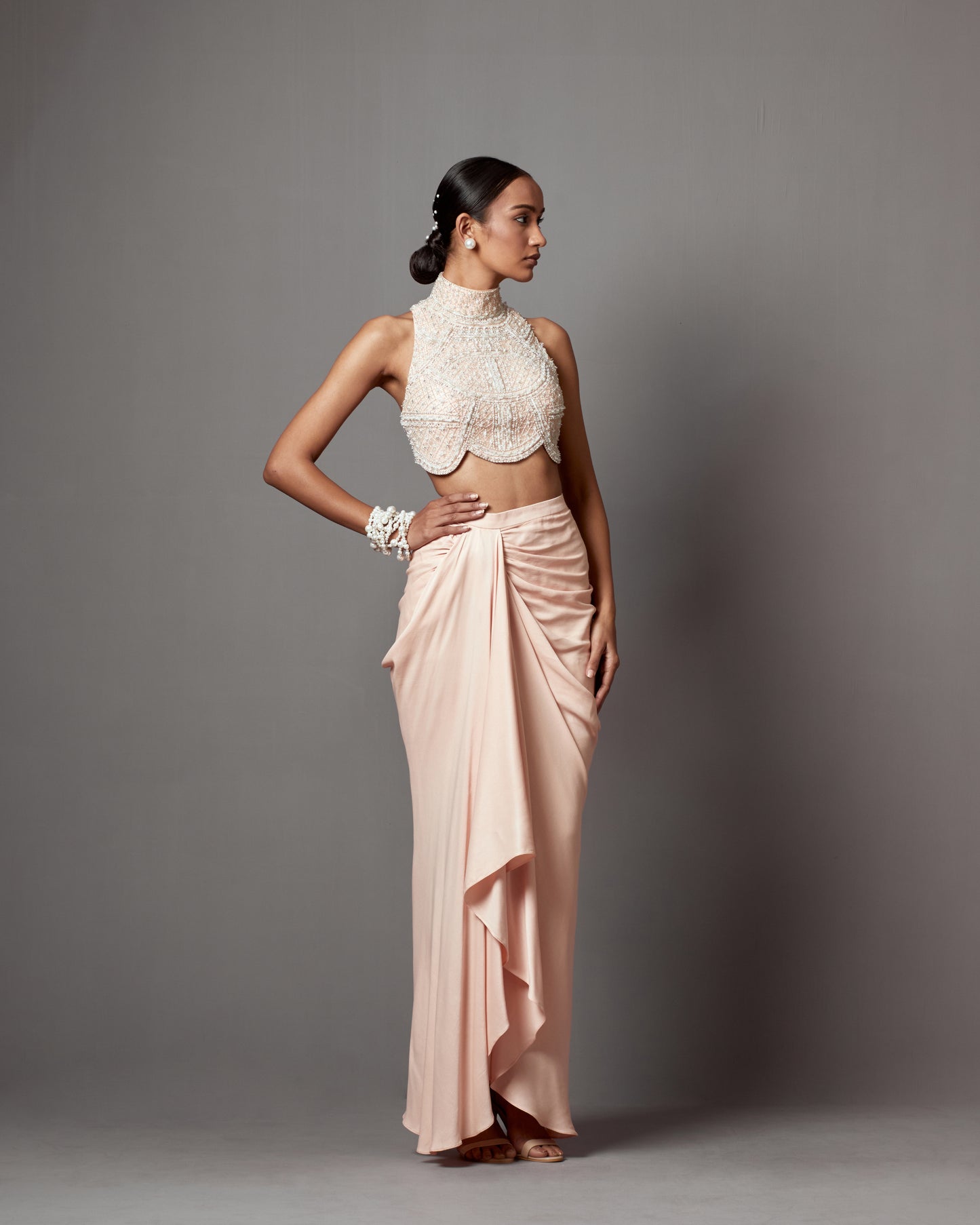 Meghana Kaur in Pastel Pink Dull Crepe Satin Wrap Skirt Set
