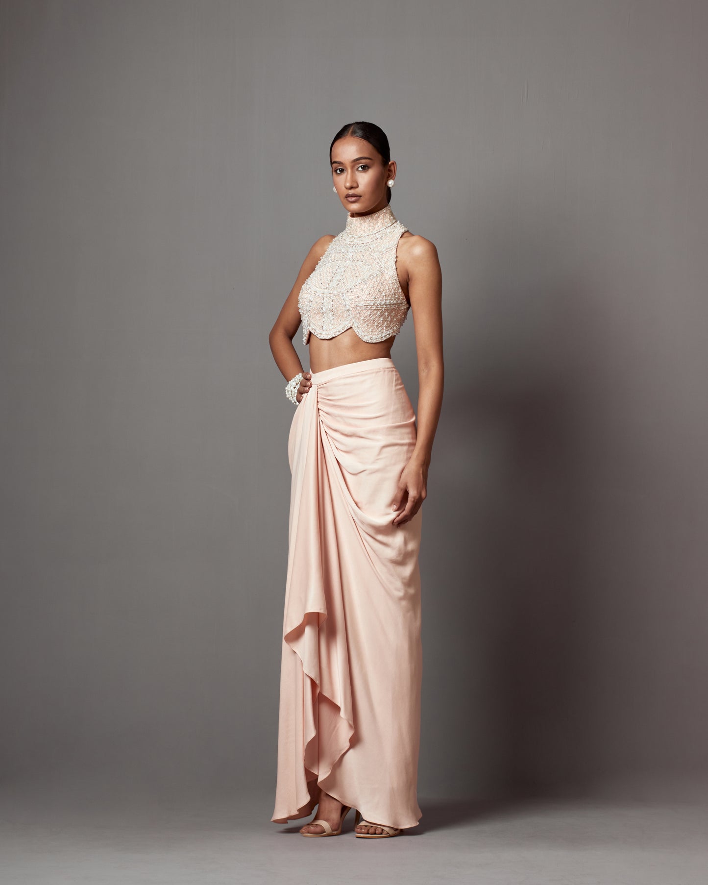 Meghana Kaur in Pastel Pink Dull Crepe Satin Wrap Skirt Set