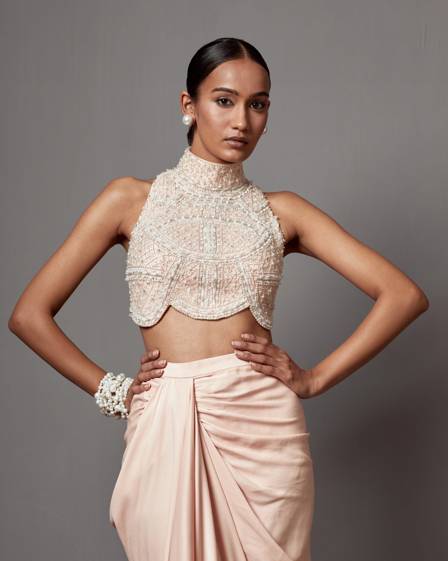 Meghana Kaur in Pastel Pink Dull Crepe Satin Wrap Skirt Set
