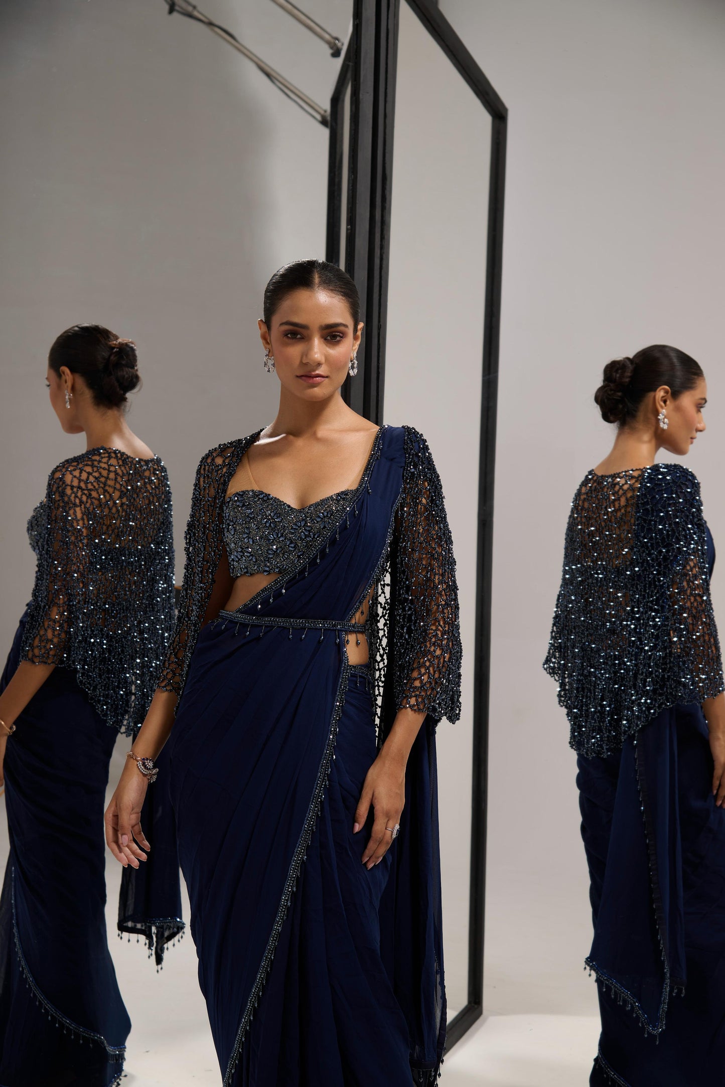 Navy blue saree set with
 crystal cape