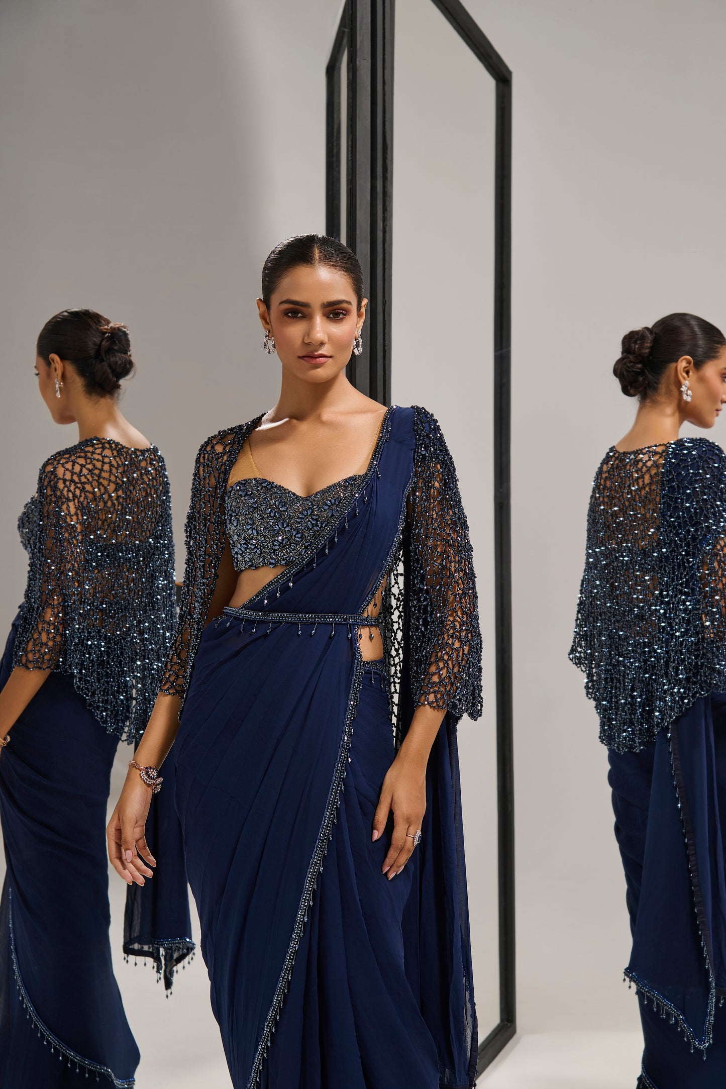 Navy blue saree set with
 crystal cape